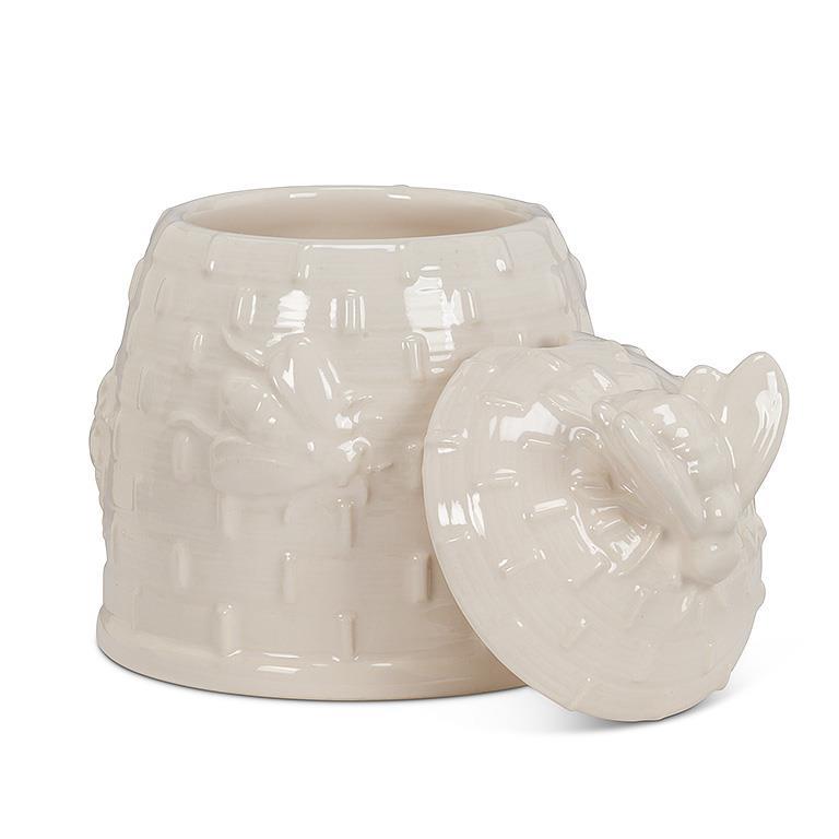 white bee hive honey pot with spoon