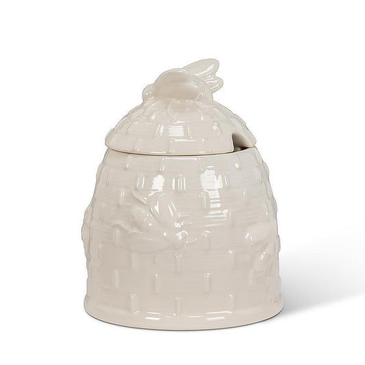 white bee hive honey pot with spoon